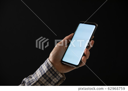 Caucasian woman using a smartphone Caucasian woman using a smartphone 62968759