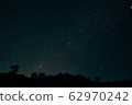 A dark sky filled with stars 62970242