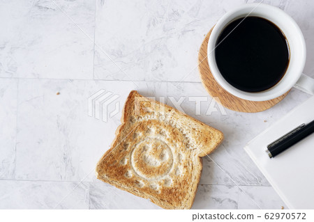 Topview flat lay of working table with coffee and 62970572