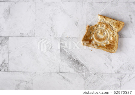 Topview flat lay of working table with toast Topview flat lay of working table with toast 62970587