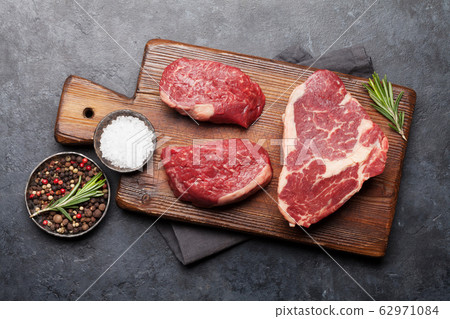 Variety of fresh raw beef steaks Variety of fresh raw beef steaks 62971084