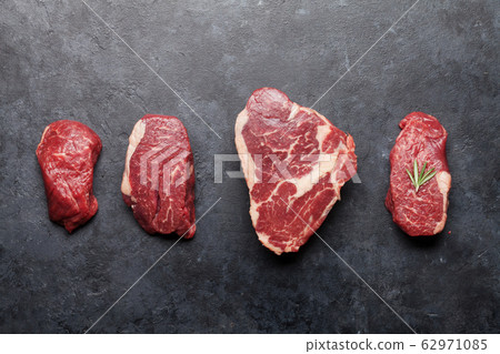 Variety of fresh raw beef steaks Variety of fresh raw beef steaks 62971085