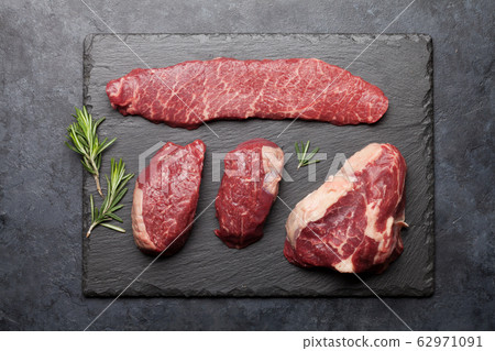 Variety of fresh raw beef steaks 62971091