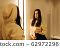 young woman in the fitting room young woman in the fitting room 62972296
