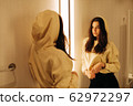 young woman in the fitting room young woman in the fitting room 62972297