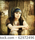 portrait of beautiful young woman with piercing 62972496