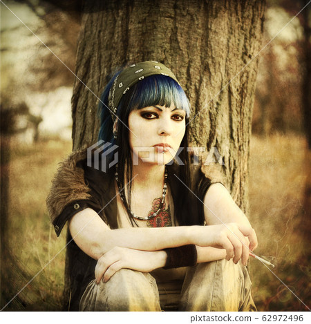 portrait of beautiful young woman with piercing portrait of beautiful young woman with piercing 62972496