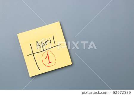 april fools day reminder on yellow sticky note. be aware and do not let be fooled 62972589