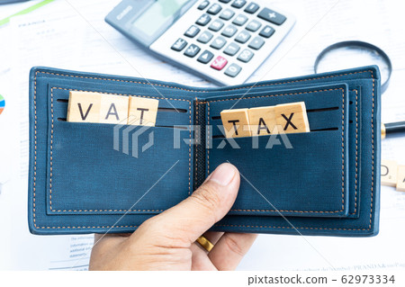 Vat and tax key word on wood block in the money wallet Vat and tax key word on wood block in the money wallet 62973334