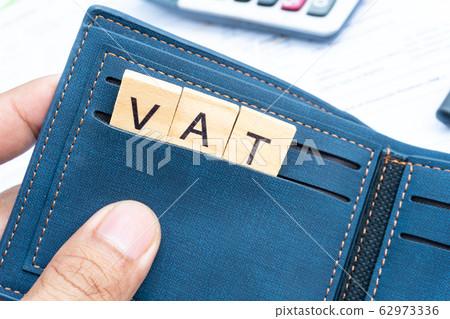 Vat key word on wood block in the money wallet Vat key word on wood block in the money wallet 62973336