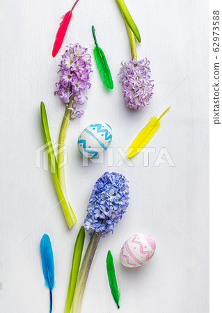 Spring Easter background. beautiful giacinths pink and blue and Easter eggs on a white background 62973588