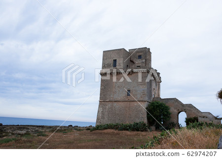 Torre Colimena in cloudy weather, a village on the Ionian Sea in the region of Apulia, watchtower of Salento Torre Colimena in cloudy weather, a village on the Ionian Sea in the region of Apulia, watchtower of Salento 62974207