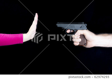 Male hand with a weapon against a child s hand, stop a weapon, stop a war 62974293