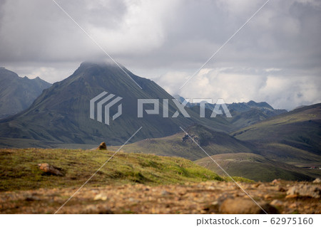 View mountain valley with green hills, river stream and lake. Laugavegur hiking trail, Iceland 62975160