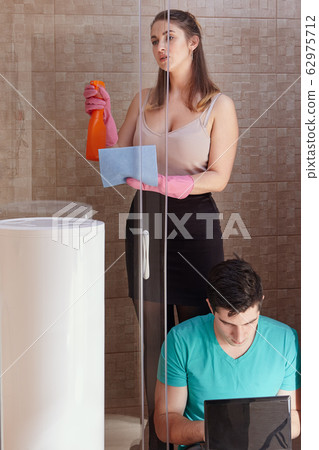 White woman is tidied up in presence of boyfriend. 62975712