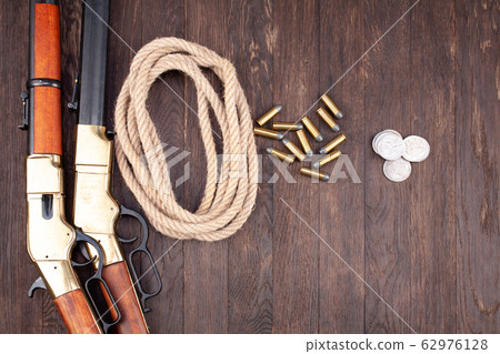 Wild west guns - lever-action repeating rifles 62976128