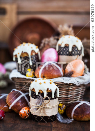 Holiday Easter cakes, hot cross buns and colorful 62976139