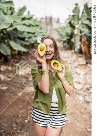Healthy woman with avocado 62976562