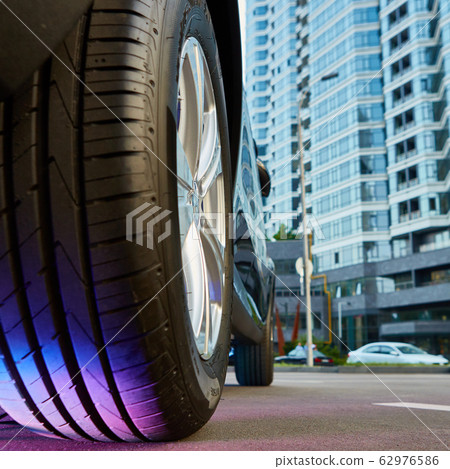 Car wheel on a car. Shallow dof. Car wheel on a car. Shallow dof. 62976586