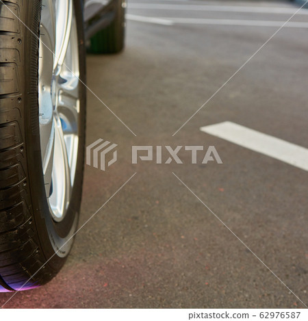 Car wheel on a car. Shallow dof. Car wheel on a car. Shallow dof. 62976587