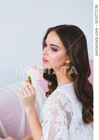 Close-up portrait of young beautiful model with rose Close-up portrait of young beautiful model with rose 62977136