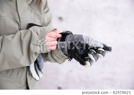 A woman snowboarding A woman snowboarding 62978625