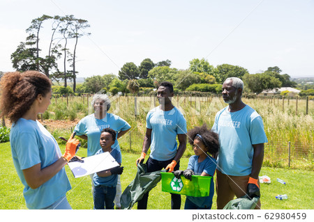 Volunteers collecting rubbish and recycling 62980459