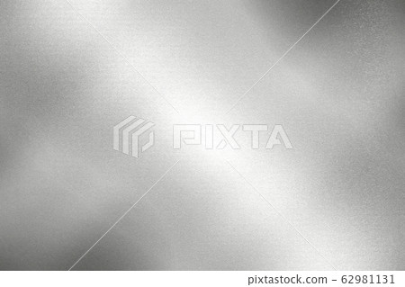 Light shining down on silver foil metal wall with 62981131