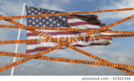 Biohazard restriction tape lines against the American flag. Restricted entry or quarantine in the USA. Conceptual 3D rendering 62982486