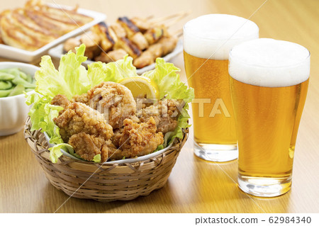 Food that matches beer_ Karaage, Yakitori, Edamame, and Gyoza 62984340
