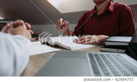 Asian young university students studying together Asian young university students studying together 62984757
