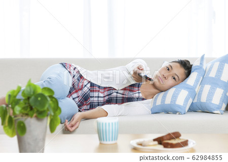 Girl operating remote control 62984855