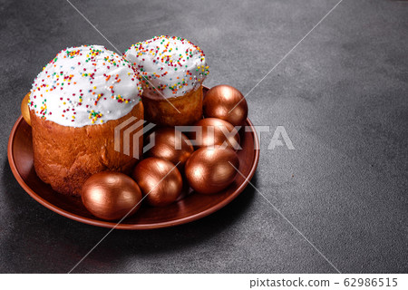 Easter eggs gold and bronze and Easter cake 62986515