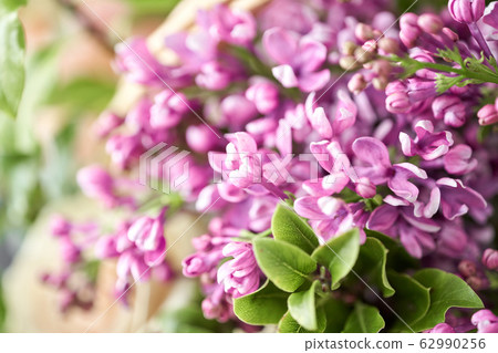 Spring bouquet in a wicker basket.. Learning flower arranging, making beautiful bouquets with your own hands. Flowers delivery 62990256