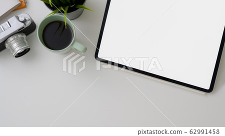 Top view of photographer workspace with blank 62991458