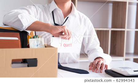 Businessman holding with I quit words card letter, 62994343