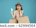 Asian girl carrying shopping bags with summer dress and enjoys shopping.  62994564