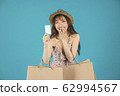 Asian girl carrying shopping bags with summer dress and enjoys shopping.  62994567