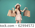 Asian girl carrying shopping bags with summer dress and enjoys shopping.  62994572