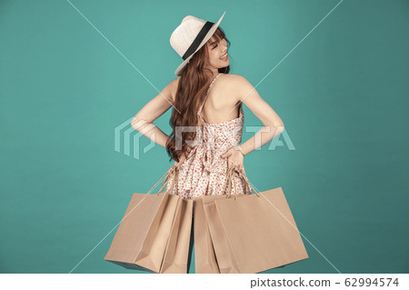 Asian girl carrying shopping bags with summer dress and enjoys shopping.  62994574