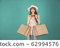 Asian girl carrying shopping bags with summer dress and enjoys shopping.  62994576
