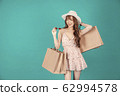 Asian girl carrying shopping bags with summer dress and enjoys shopping.  62994578