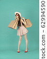 Asian girl carrying shopping bags with summer dress and enjoys shopping.  62994590