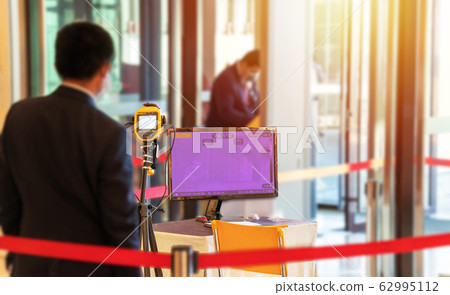 thermoscan camera at screening points at the entrance of shopping mall to preventive measures against the spread of the COVID-19 virus out of concern for the well-being and safety of customer 62995112