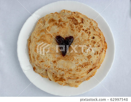 homemade russian pancake isolated on white background, close-up, top view 62997548