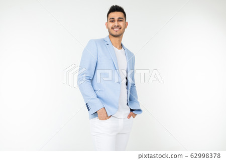 handsome guy in a blue jacket with a beautiful smile on a white isolated background with copy space 62998378