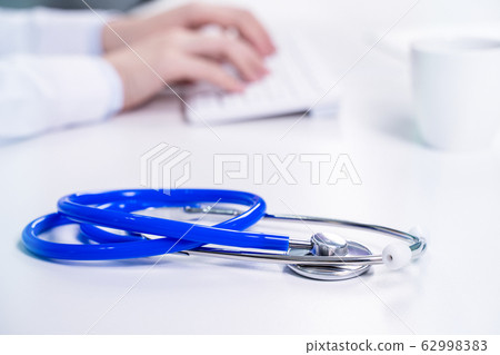 Doctor female working office typing stethoscope Doctor female working Doctor female working office typing stethoscope Doctor female working 62998383