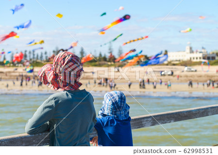Children watching kites from Semaphore Jetty Children watching kites from Semaphore Jetty 62998531