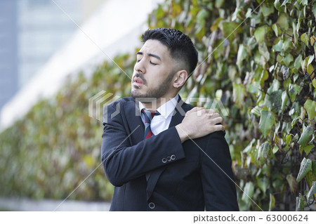 Business man, worry, stiff shoulders 63000624