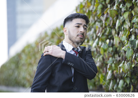 Business man, worry, stiff shoulders 63000626